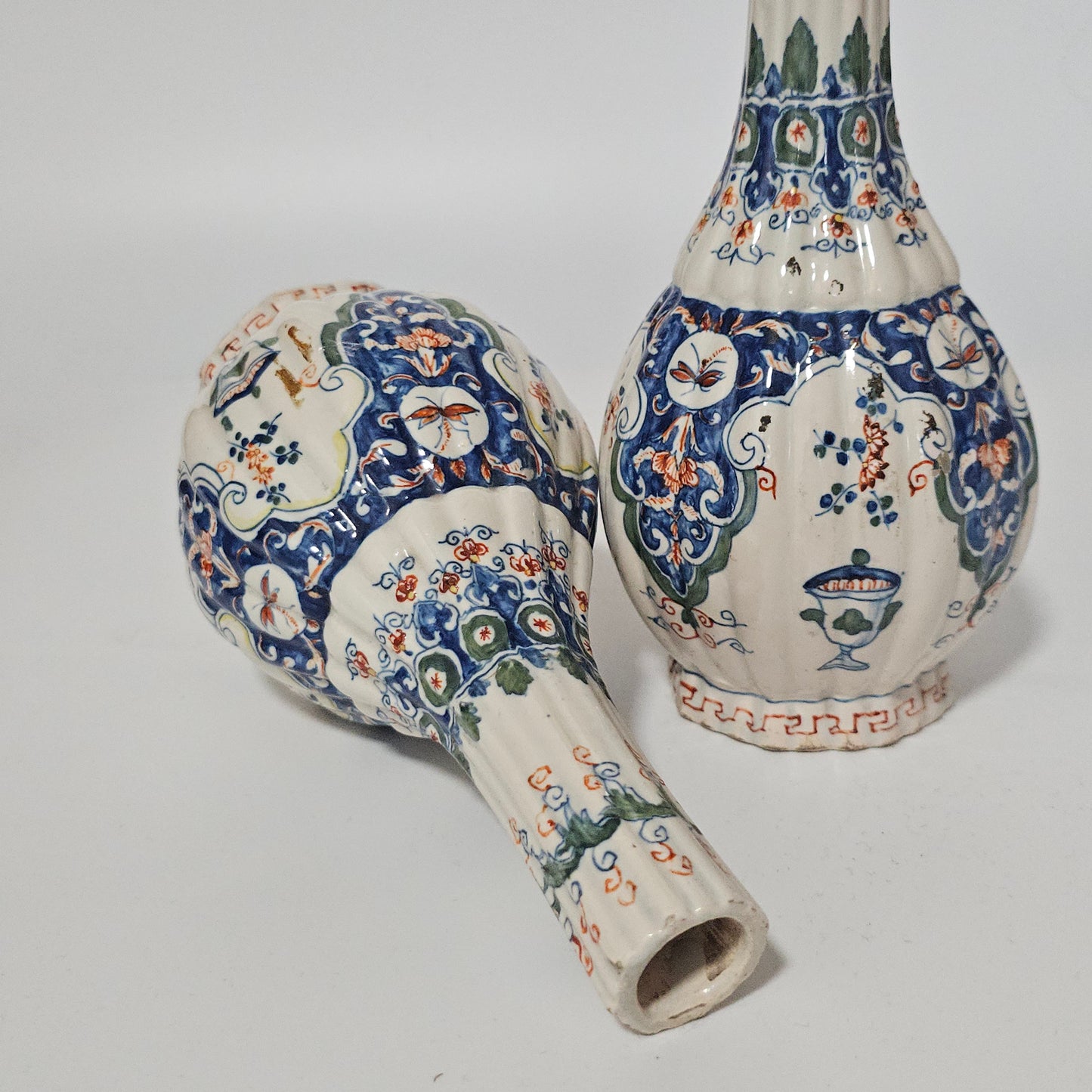 A Matched Pair of Dutch Delft Ribbed Bottle Vases c 1700/1720