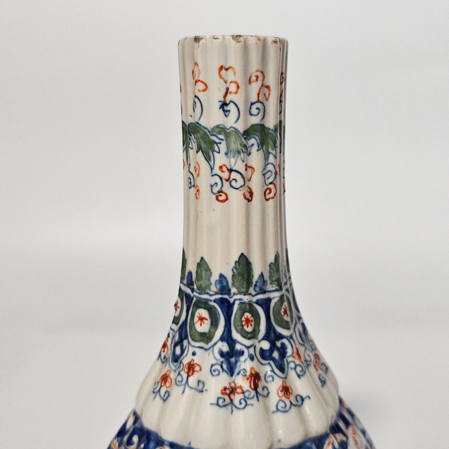 A Matched Pair of Dutch Delft Ribbed Bottle Vases c 1700/1720