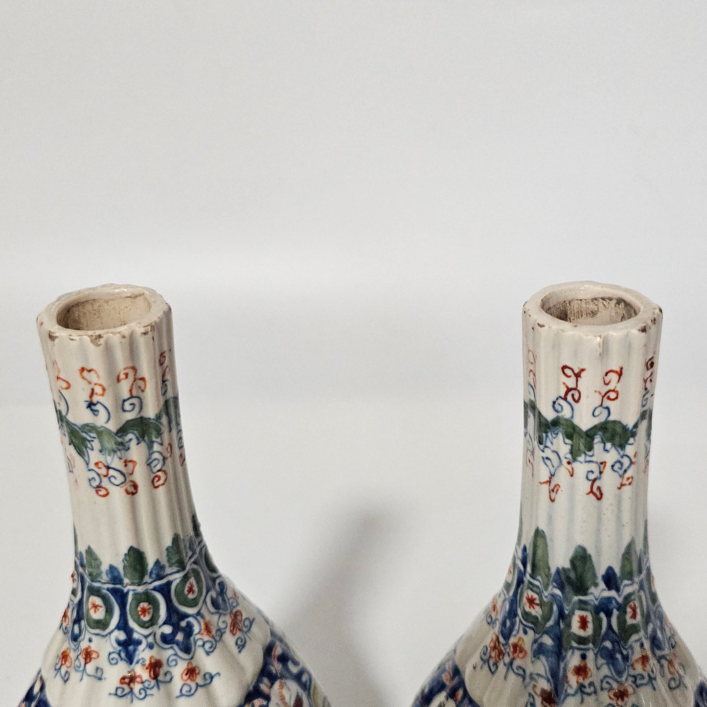 A Matched Pair of Dutch Delft Ribbed Bottle Vases c 1700/1720