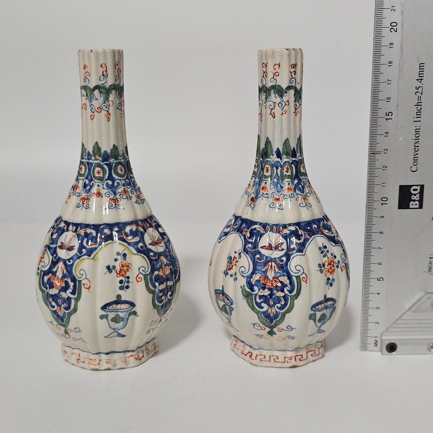 A Matched Pair of Dutch Delft Ribbed Bottle Vases c 1700/1720