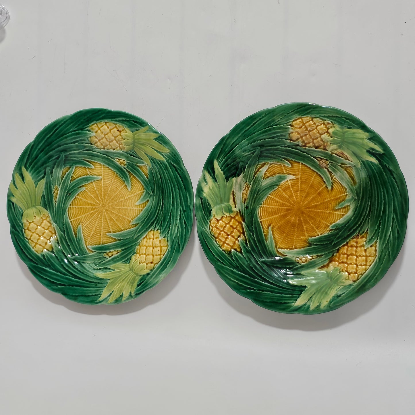 Fine Pair of George Jones Majolica Pineapples on Basketweave Plates, English, ca. 1870