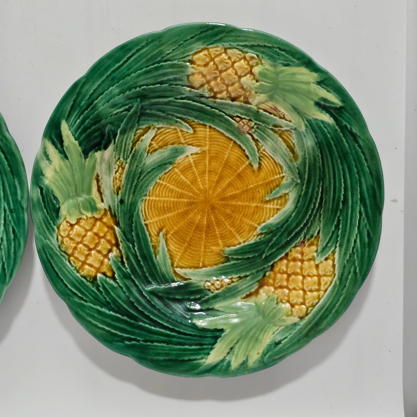 Fine Pair of George Jones Majolica Pineapples on Basketweave Plates, English, ca. 1870