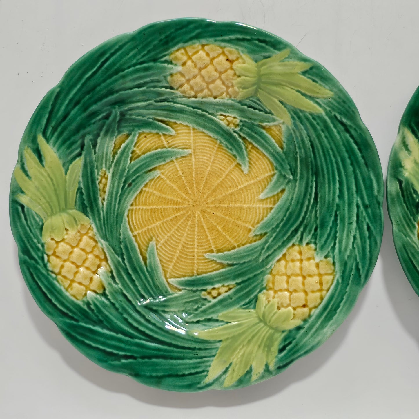 Fine Pair of George Jones Majolica Pineapples on Basketweave Plates, English, ca. 1870