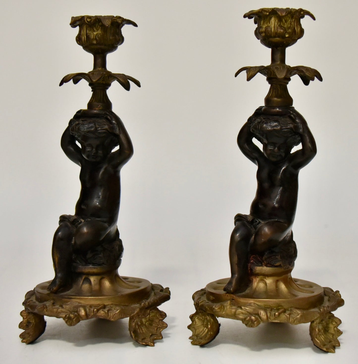 Attractive Pair of Bronze and Brass Cherub Candlesticks, circa 1900