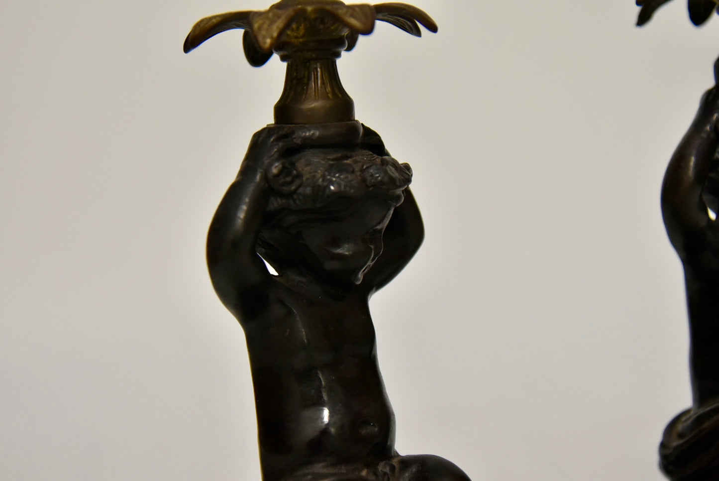 Attractive Pair of Bronze and Brass Cherub Candlesticks, circa 1900