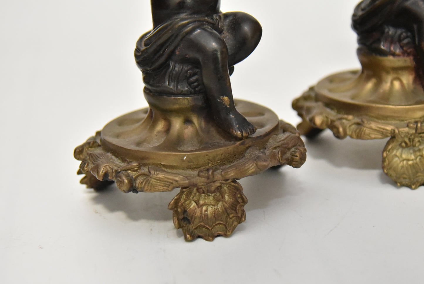 Attractive Pair of Bronze and Brass Cherub Candlesticks, circa 1900