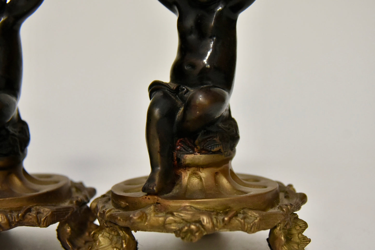 Attractive Pair of Bronze and Brass Cherub Candlesticks, circa 1900