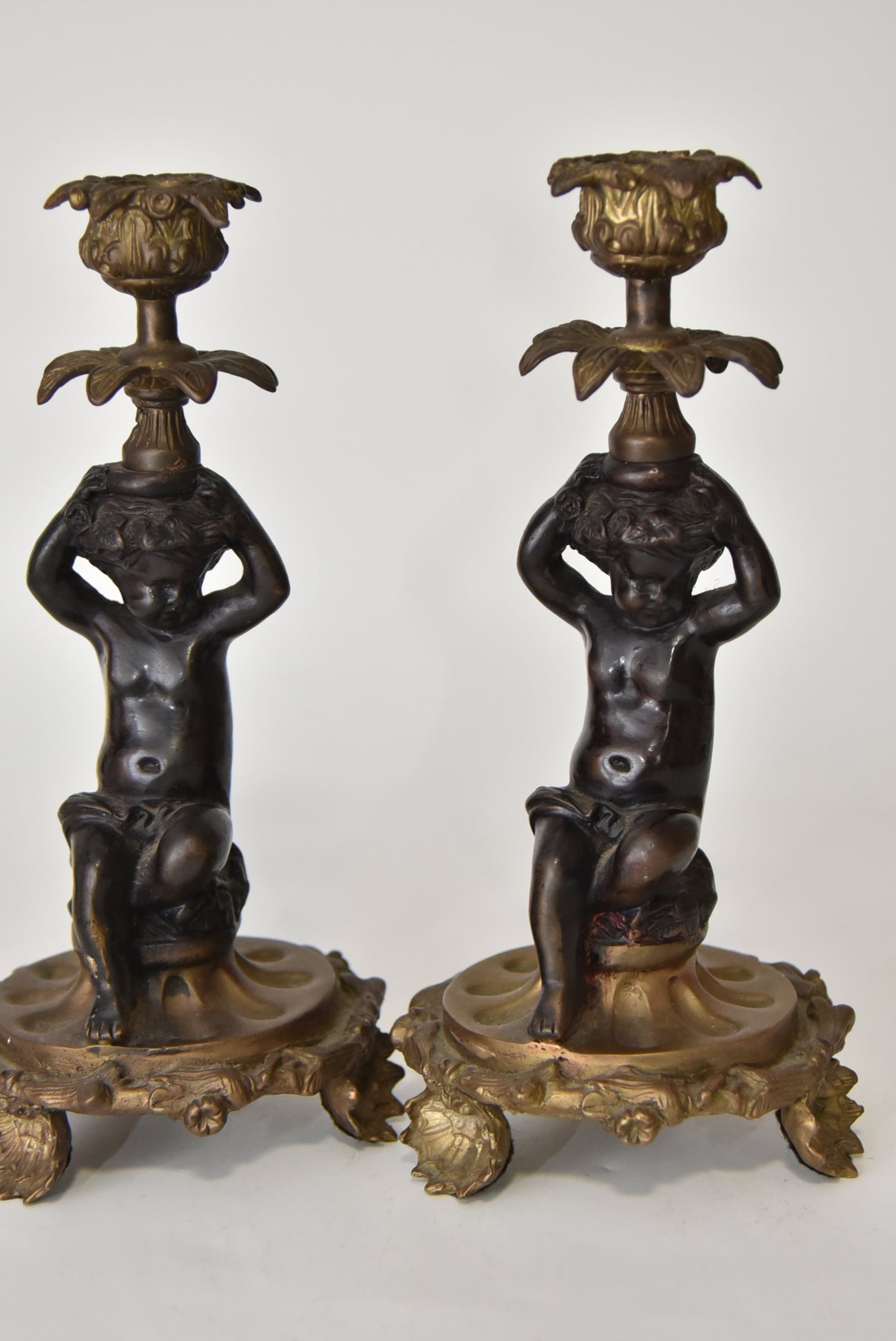 Attractive Pair of Bronze and Brass Cherub Candlesticks, circa 1900