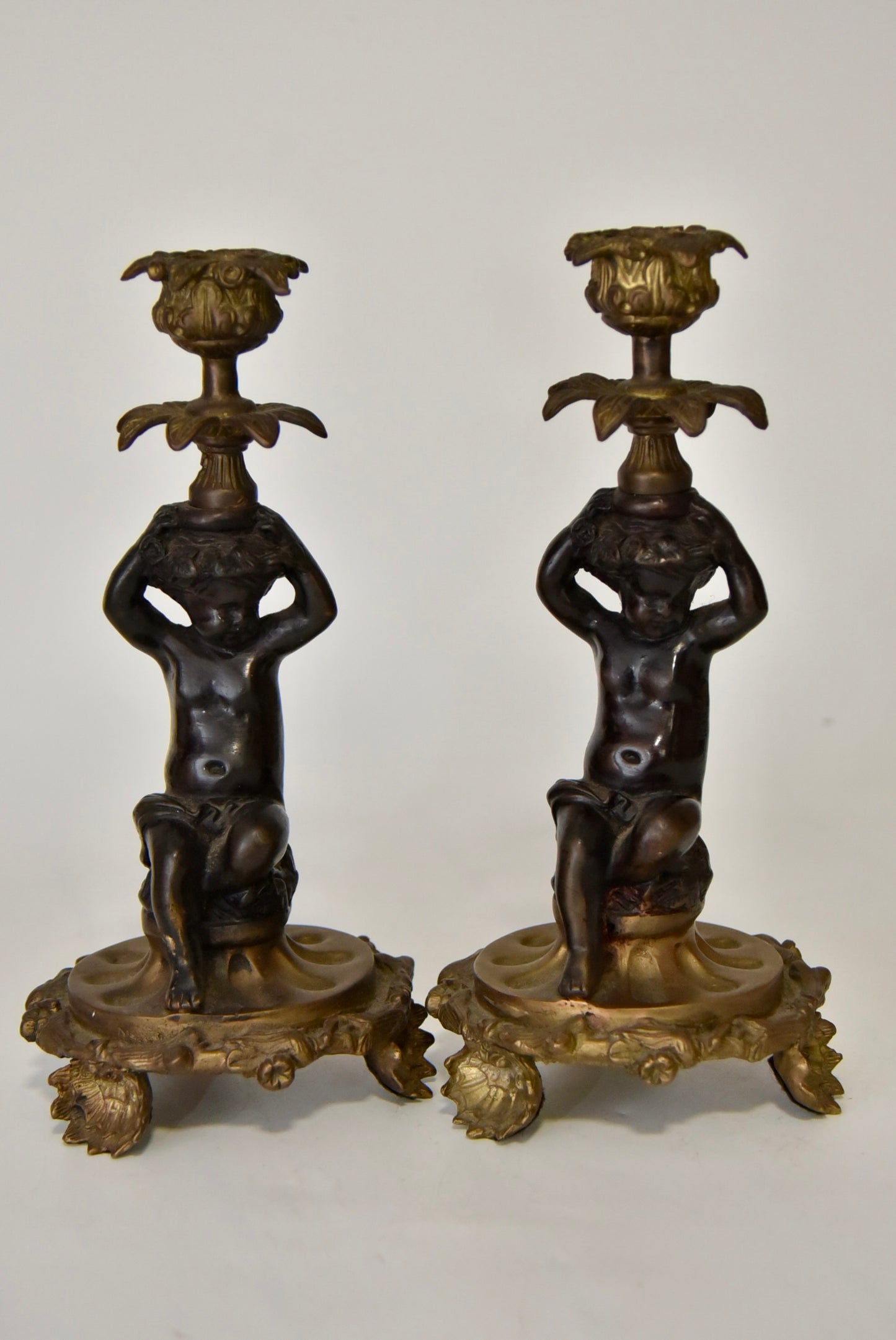 Attractive Pair of Bronze and Brass Cherub Candlesticks, circa 1900