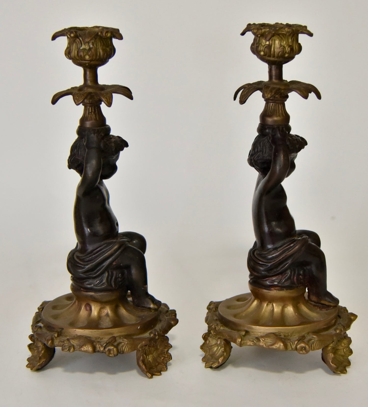 Attractive Pair of Bronze and Brass Cherub Candlesticks, circa 1900