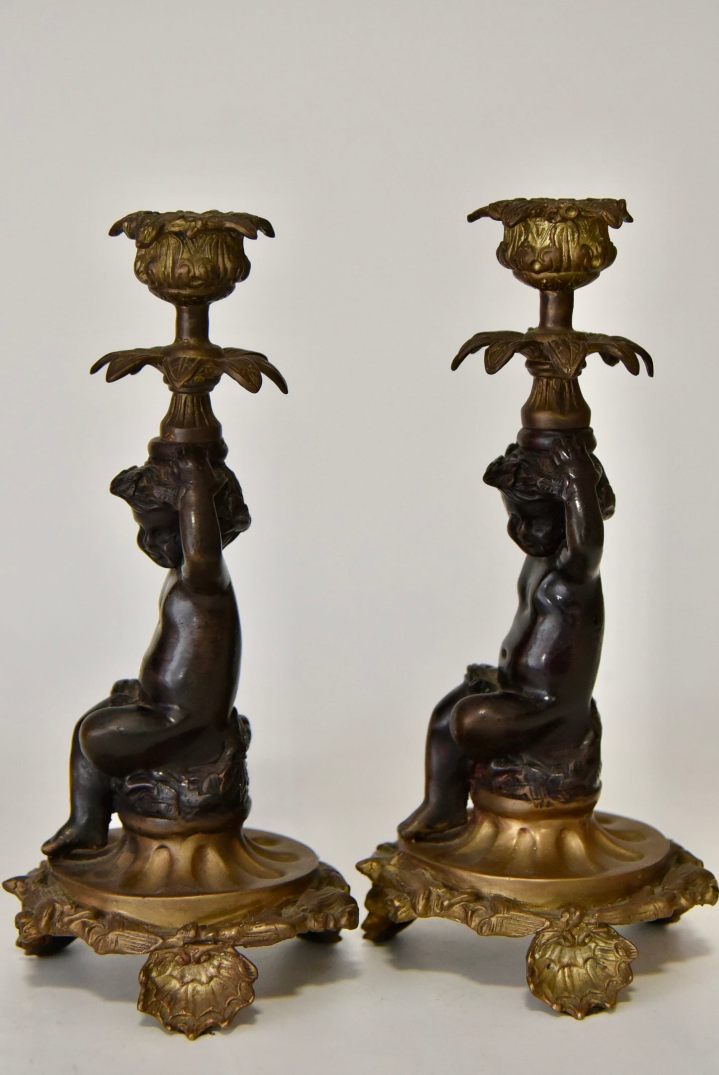 Attractive Pair of Bronze and Brass Cherub Candlesticks, circa 1900