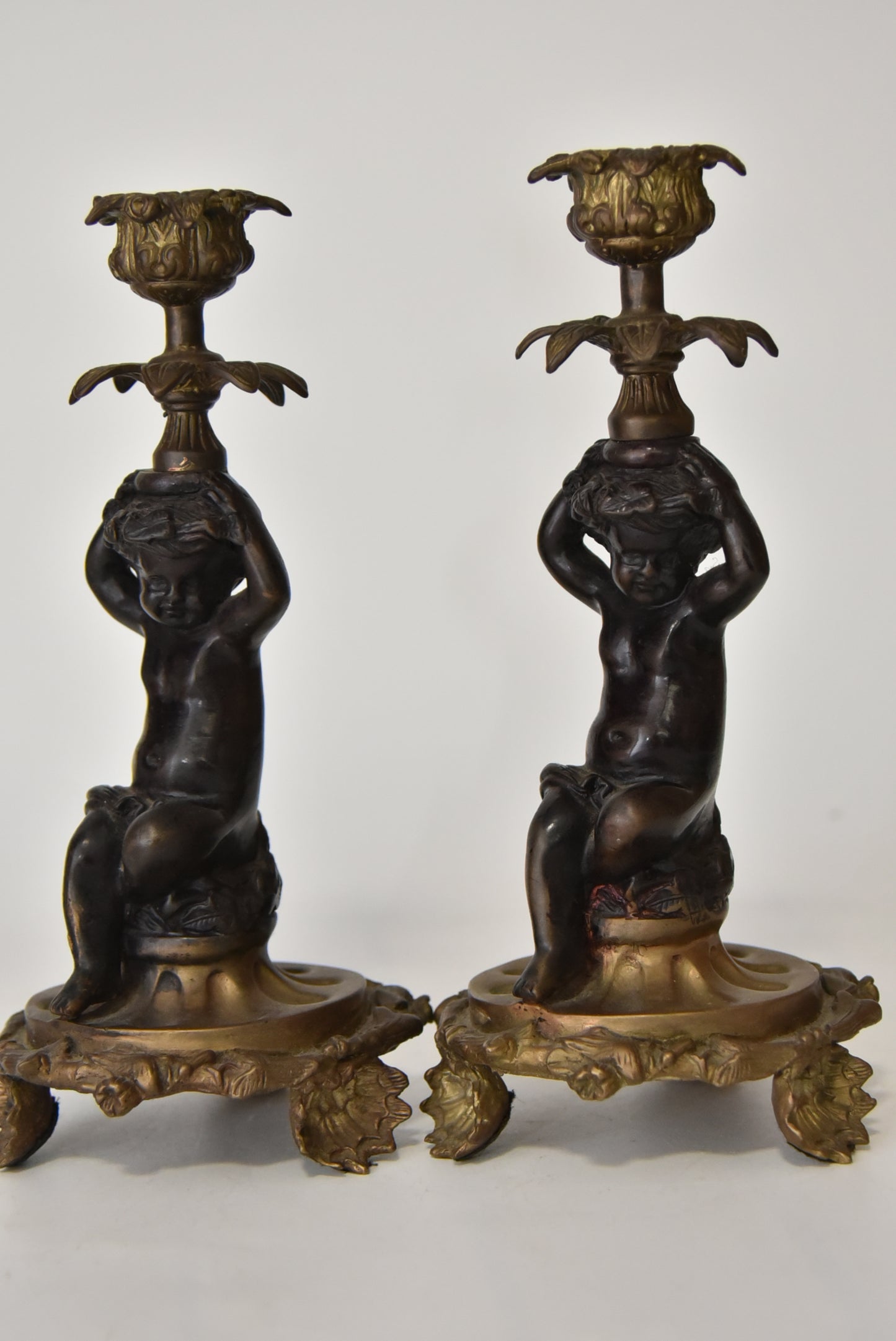 Attractive Pair of Bronze and Brass Cherub Candlesticks, circa 1900
