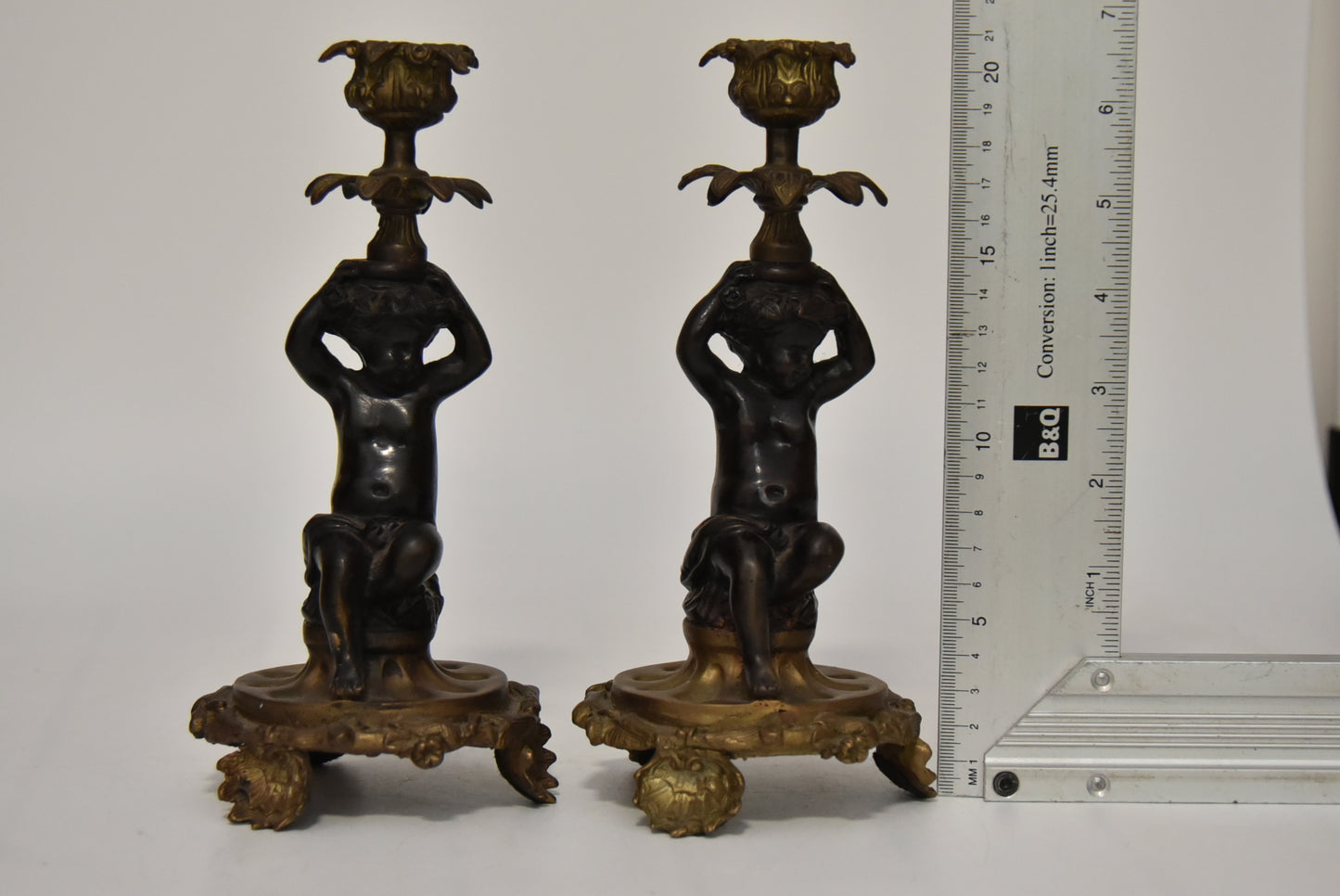 Attractive Pair of Bronze and Brass Cherub Candlesticks, circa 1900