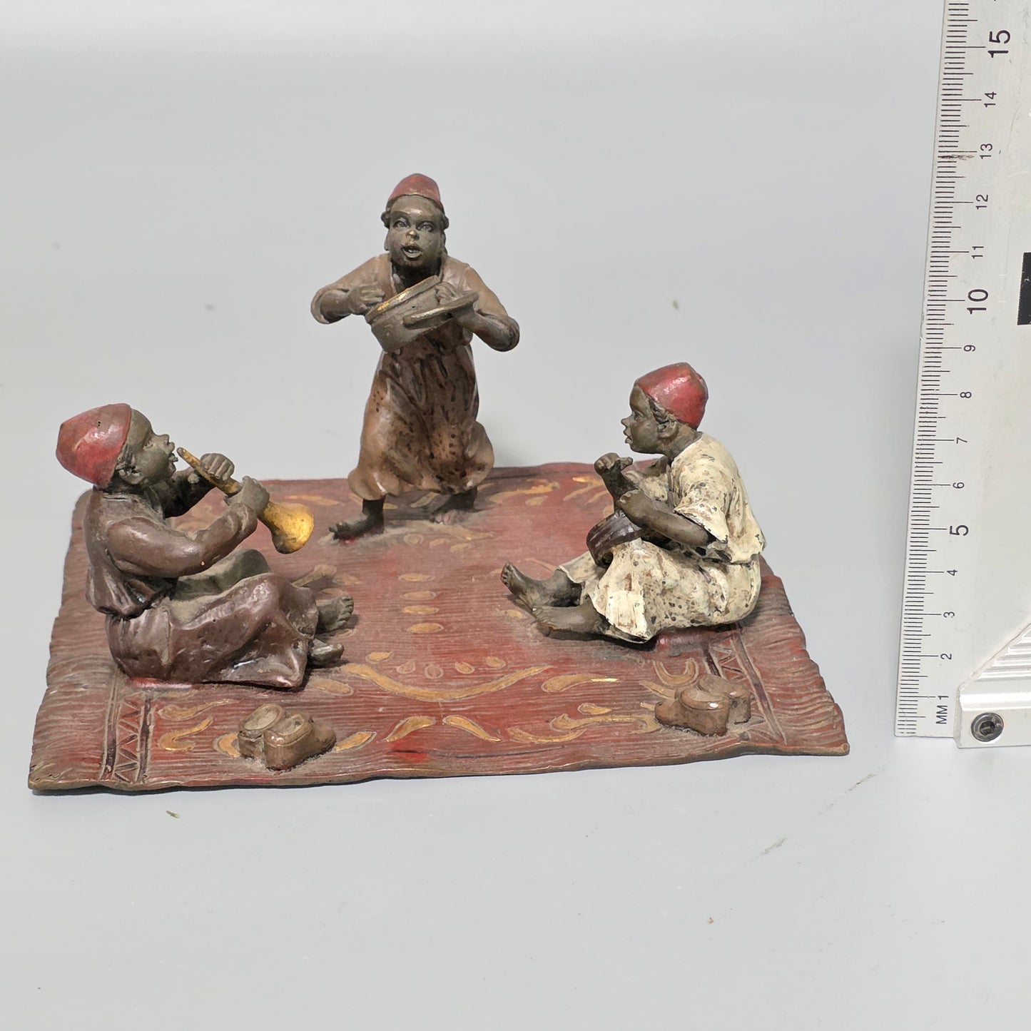 Franz Bergman (Austrian, 1861-1936) An Orientalist cold painted bronze group depicting three musicians on a rug Stamped 'Namgreb and B' and numbered '7813'