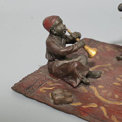 Franz Bergman (Austrian, 1861-1936) An Orientalist cold painted bronze group depicting three musicians on a rug Stamped 'Namgreb and B' and numbered '7813'