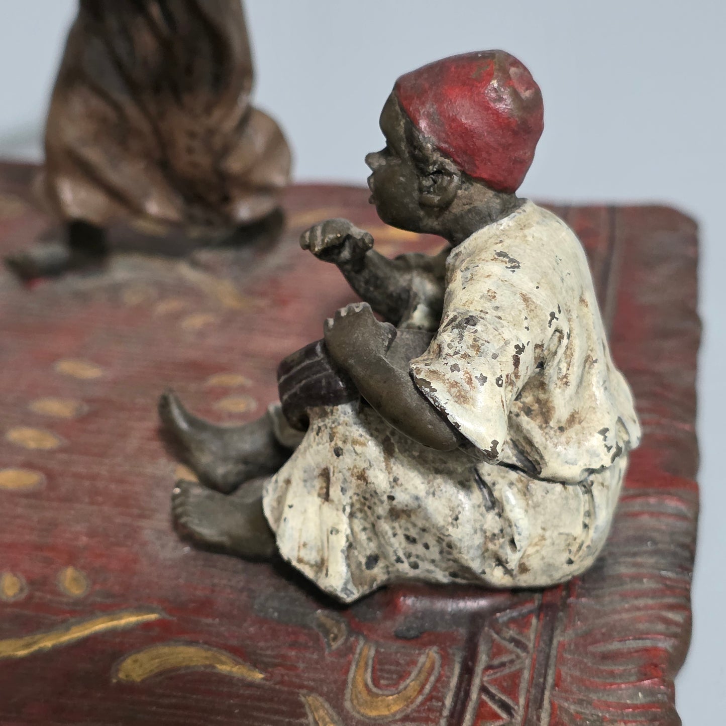 Franz Bergman (Austrian, 1861-1936) An Orientalist cold painted bronze group depicting three musicians on a rug Stamped 'Namgreb and B' and numbered '7813'