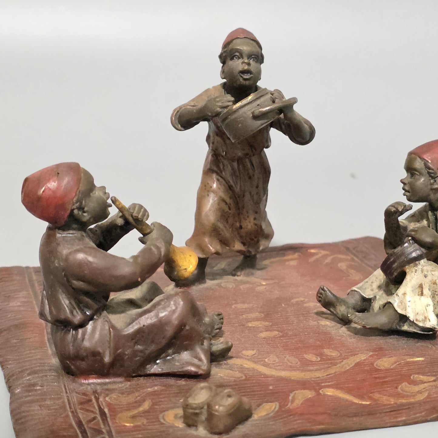 Franz Bergman (Austrian, 1861-1936) An Orientalist cold painted bronze group depicting three musicians on a rug Stamped 'Namgreb and B' and numbered '7813'