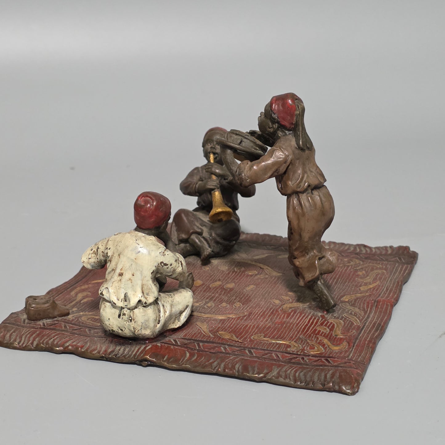 Franz Bergman (Austrian, 1861-1936) An Orientalist cold painted bronze group depicting three musicians on a rug Stamped 'Namgreb and B' and numbered '7813'