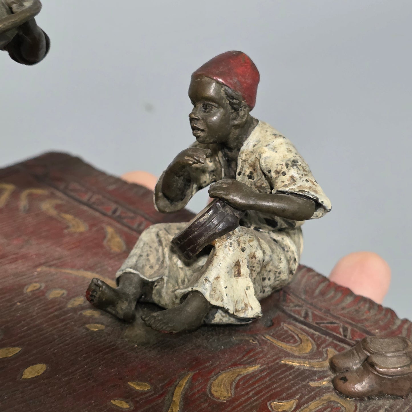Franz Bergman (Austrian, 1861-1936) An Orientalist cold painted bronze group depicting three musicians on a rug Stamped 'Namgreb and B' and numbered '7813'