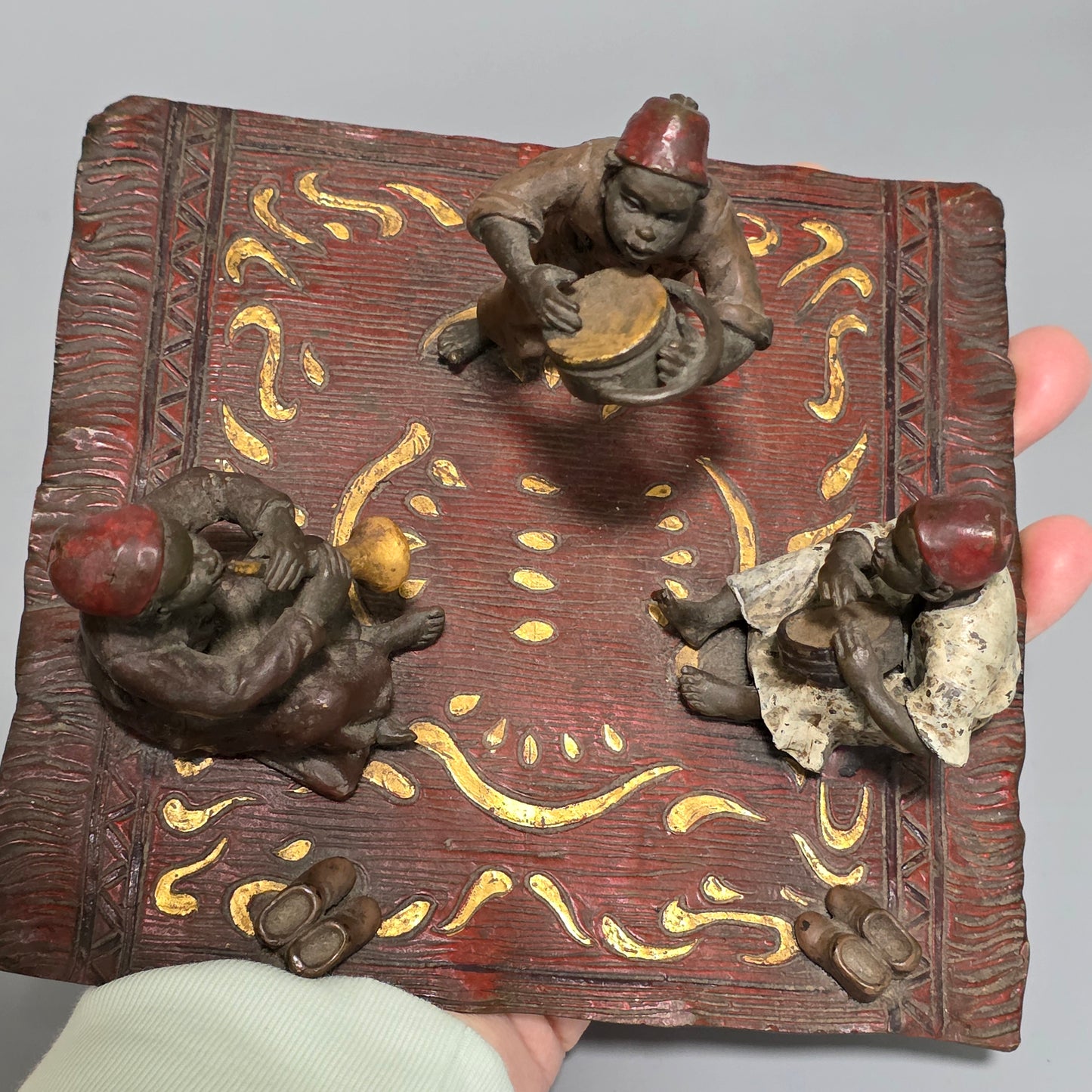 Franz Bergman (Austrian, 1861-1936) An Orientalist cold painted bronze group depicting three musicians on a rug Stamped 'Namgreb and B' and numbered '7813'