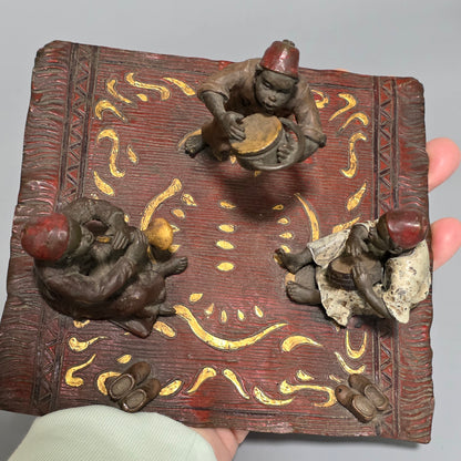 Franz Bergman (Austrian, 1861-1936) An Orientalist cold painted bronze group depicting three musicians on a rug Stamped 'Namgreb and B' and numbered '7813'