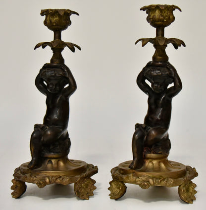 Attractive Pair of Bronze and Brass Cherub Candlesticks, circa 1900