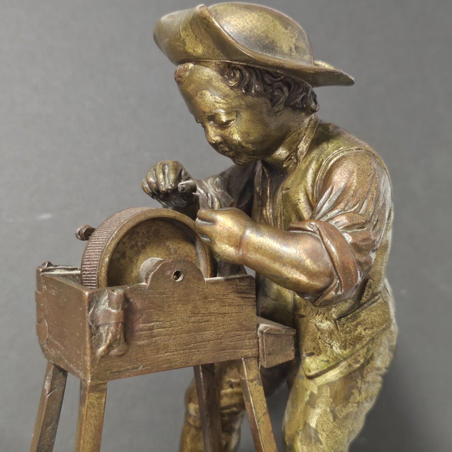 Charles-louis Menne (swedish, 1822–1894) A Gilt Bronze Match Holder & Striker, Cast As A Boy Sharpening A Knife Upon A Grinding Wheel