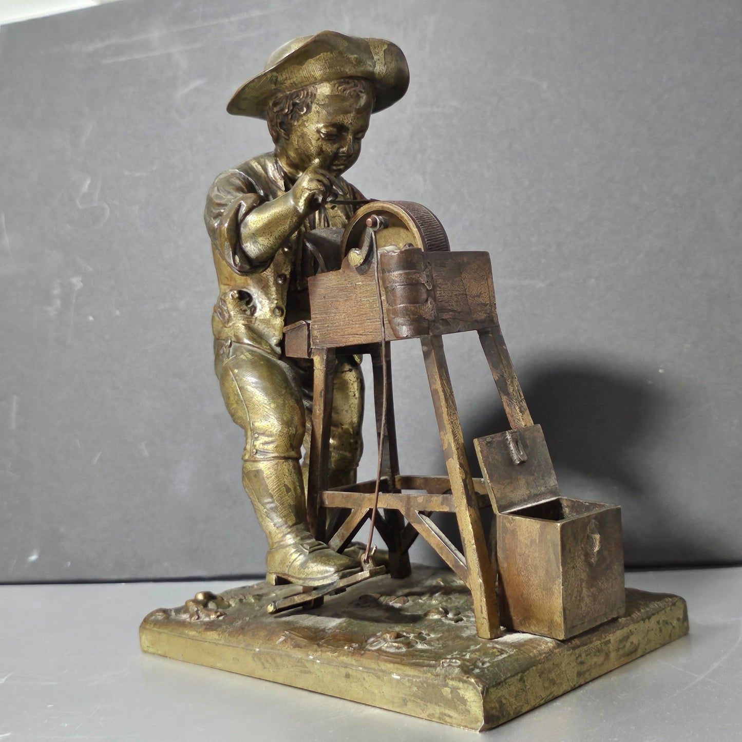 Charles-louis Menne (swedish, 1822–1894) A Gilt Bronze Match Holder & Striker, Cast As A Boy Sharpening A Knife Upon A Grinding Wheel